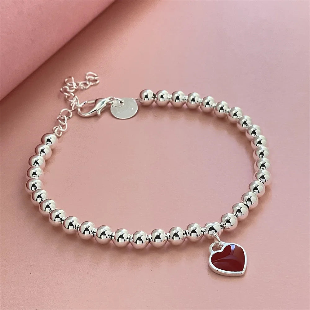 Pulseira Vermelha com Pingente de Coração em Prata Esterlina 925 – Elegância Clássica