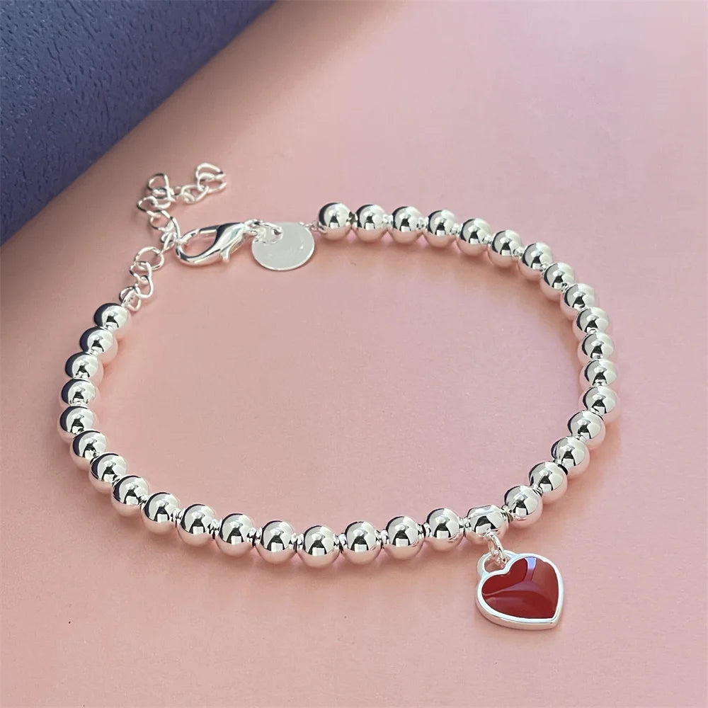 Pulseira Vermelha com Pingente de Coração em Prata Esterlina 925 – Elegância Clássica