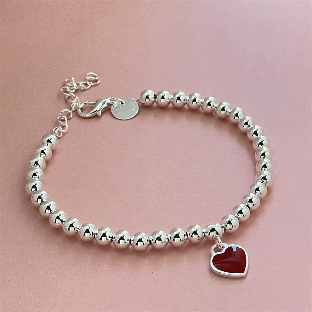 Pulseira Vermelha com Pingente de Coração em Prata Esterlina 925 – Elegância Clássica